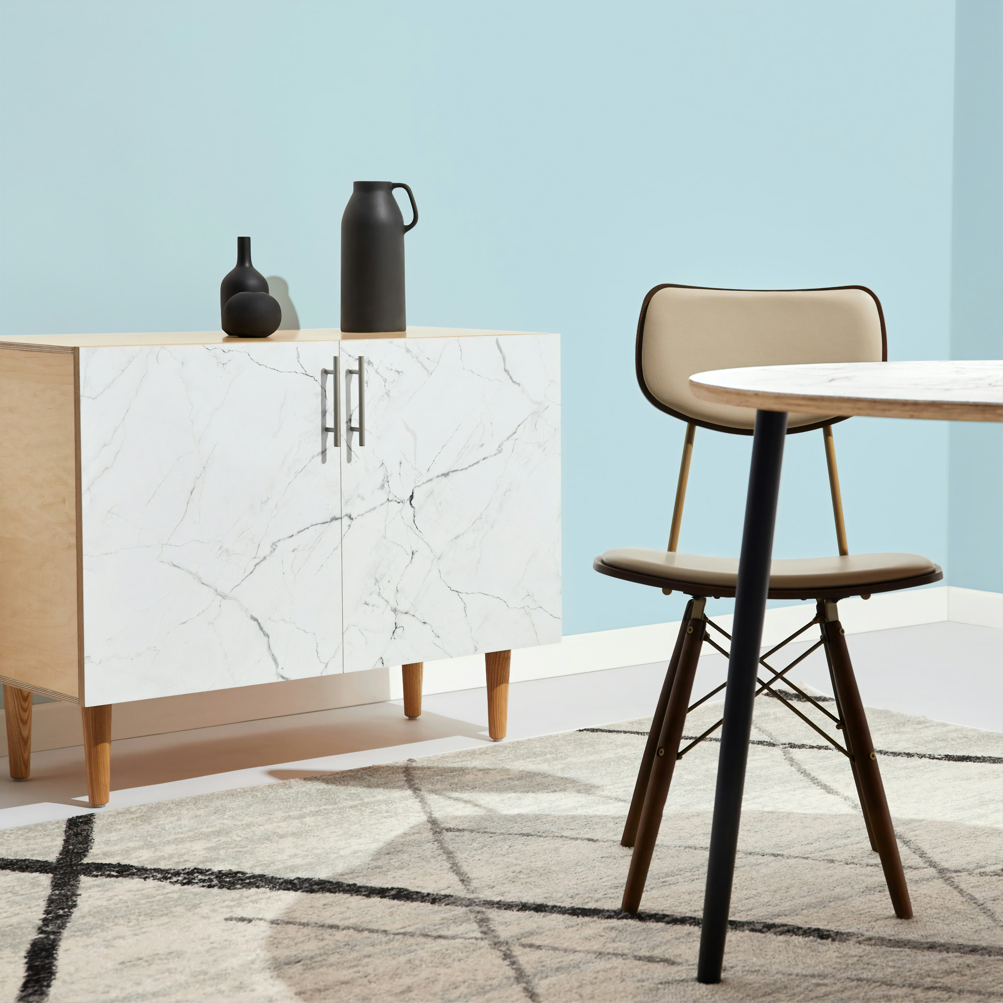 Hero shot of a luxury custom kitchen with marble island and walnut cabinetry