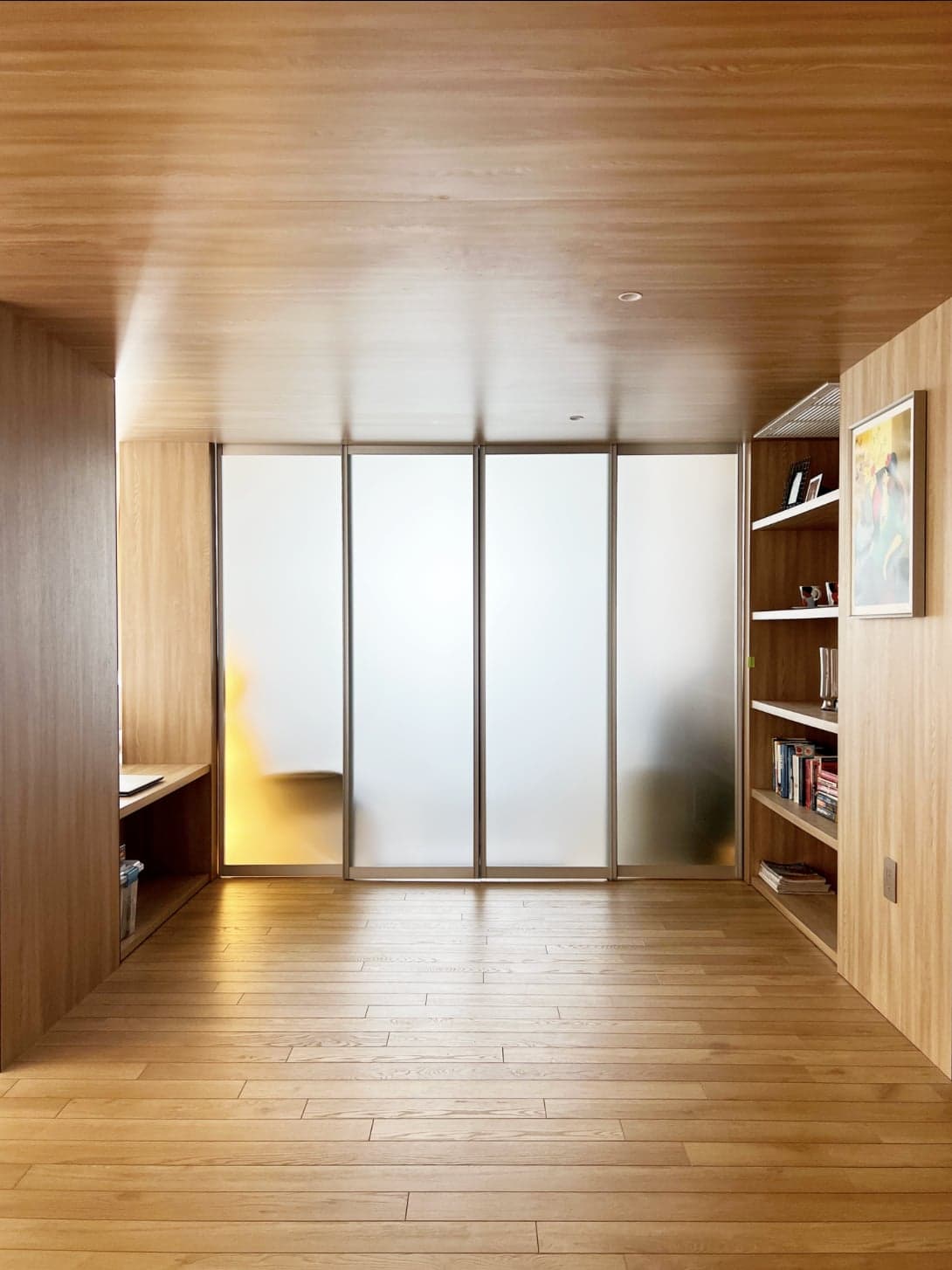 Alder-veneer architectural millwork with concealed doors and built-in desk — Farm residence, Aventura